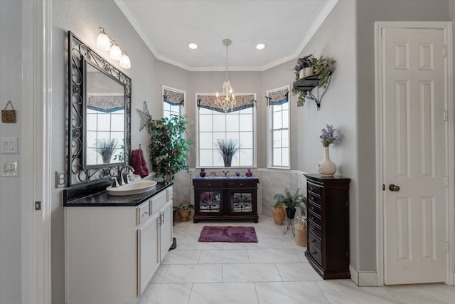 bathroom featuring an inviting chandelier, tile patterned flooring, vanity, and ornamental molding