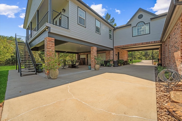 view of side of home featuring a carport