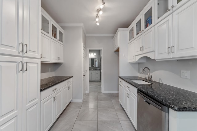 kitchen with dark stone counters, track lighting, white cabinetry, dishwasher, and crown molding