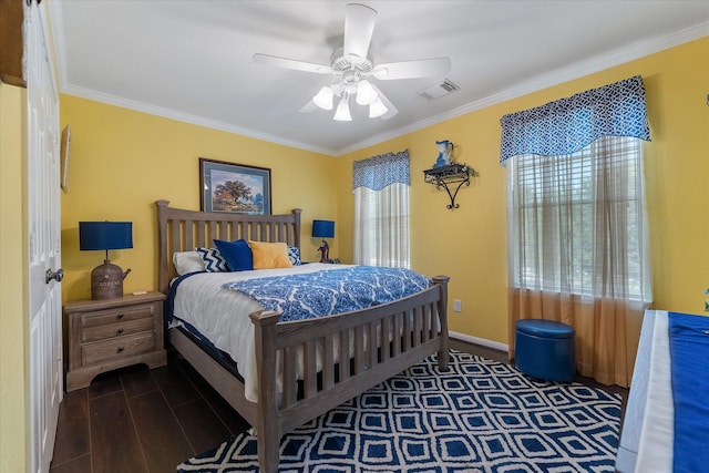 bedroom with ceiling fan and crown molding