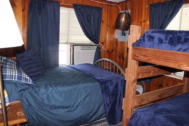 bedroom with wooden walls