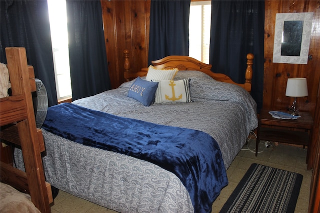 tiled bedroom with wood walls