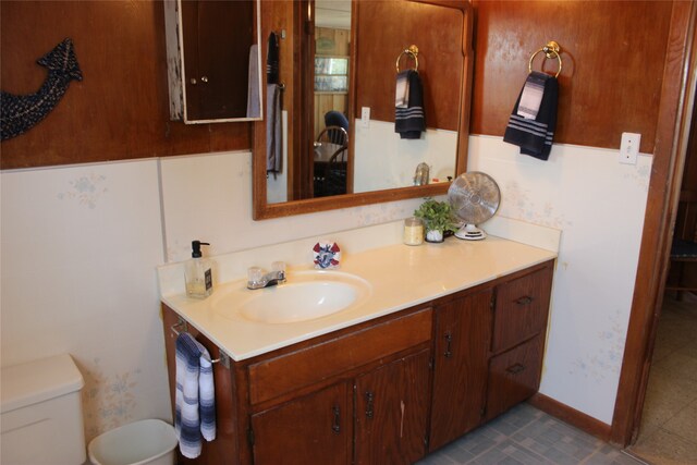 bathroom with tile patterned floors, toilet, and vanity