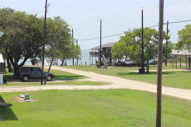 view of home's community featuring a yard