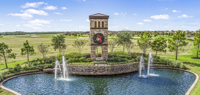 surrounding community featuring a water view