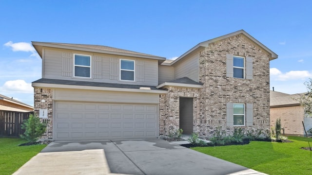 view of front of home with a garage and a front lawn