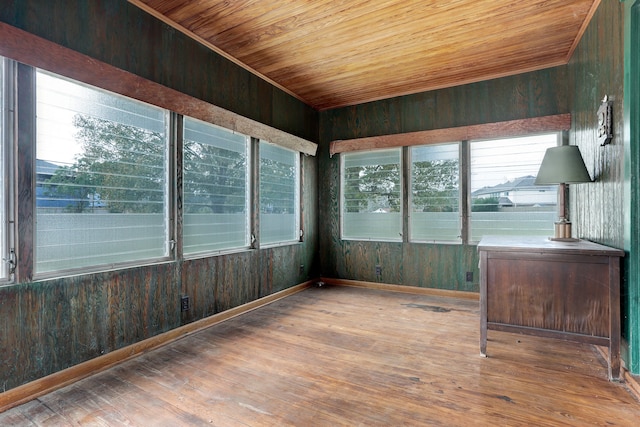 unfurnished sunroom with wood ceiling