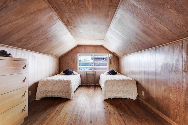 unfurnished bedroom featuring wood walls, lofted ceiling, hardwood / wood-style flooring, and wood ceiling