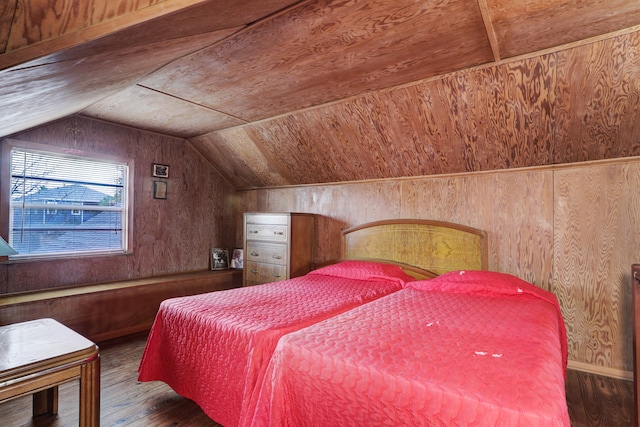 bedroom with wood walls, wooden ceiling, vaulted ceiling, and dark wood-type flooring