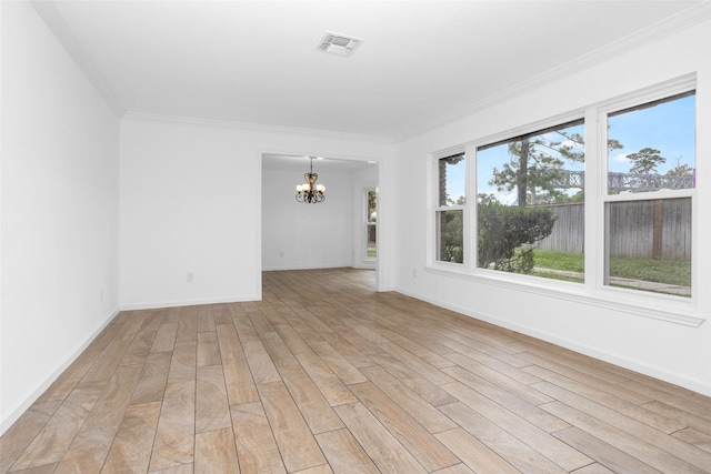 unfurnished room with an inviting chandelier, visible vents, light wood-style floors, and ornamental molding