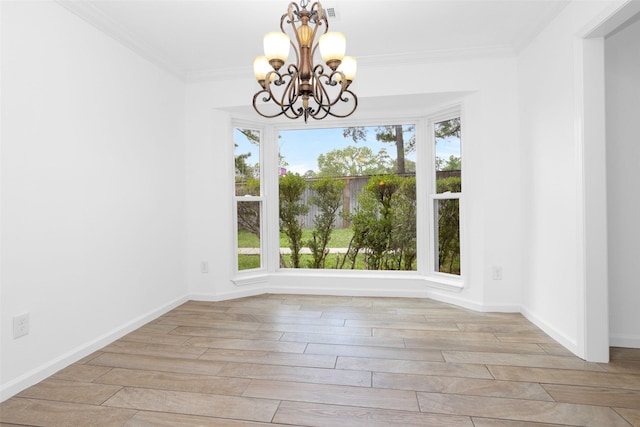 unfurnished dining area with a chandelier, baseboards, crown molding, and light wood finished floors