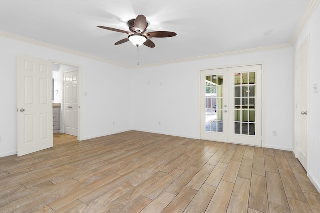 empty room featuring light wood-style floors, baseboards, crown molding, and french doors