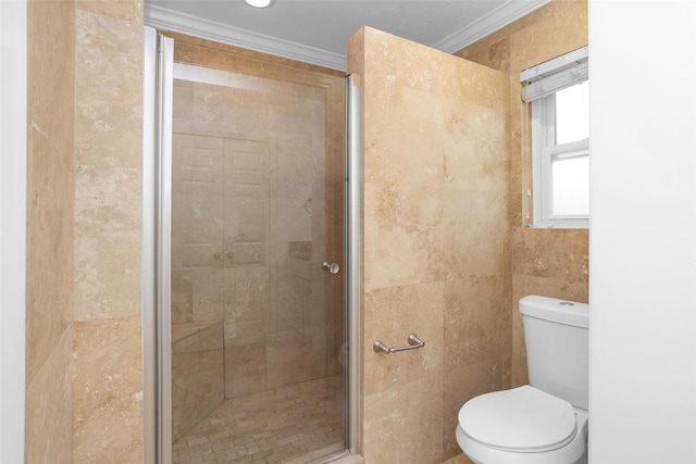 bathroom with a stall shower, crown molding, tile walls, and toilet