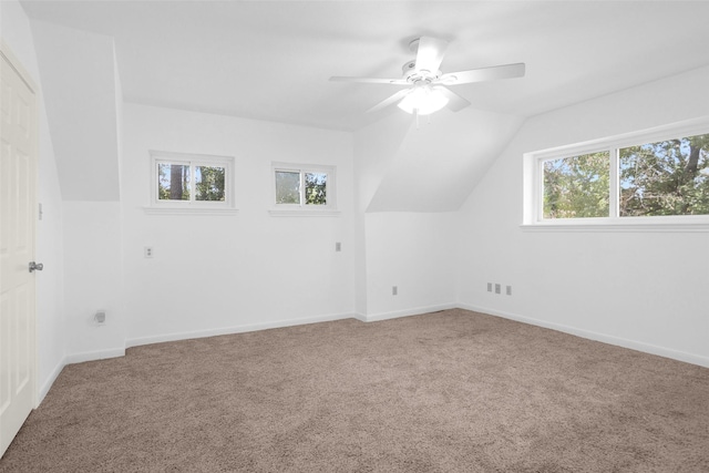 additional living space featuring carpet, ceiling fan, lofted ceiling, and baseboards