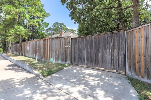 exterior space featuring a gate and fence