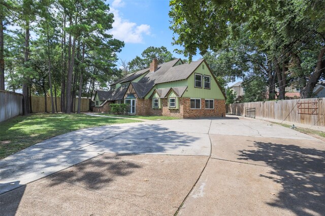 back of house with a lawn