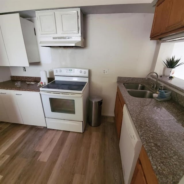 kitchen featuring sink, white appliances, dark wood-type flooring, and white cabinets