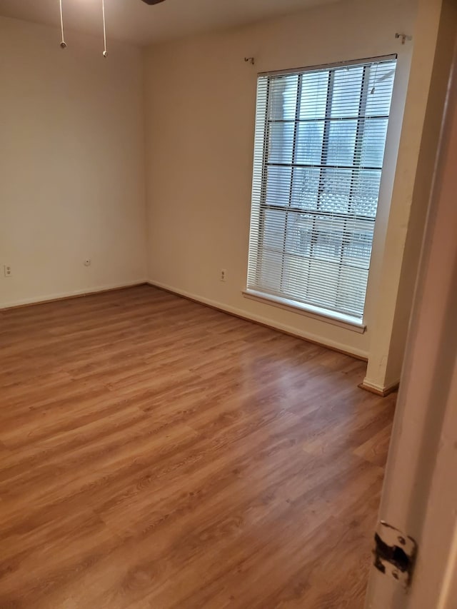 spare room featuring hardwood / wood-style floors