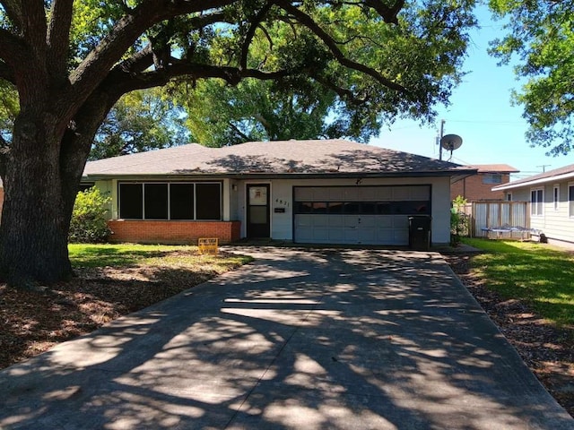 single story home with a garage