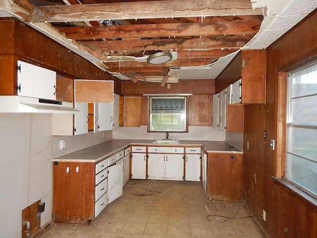 kitchen with white cabinetry and light tile patterned floors