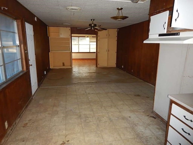 interior space featuring ceiling fan