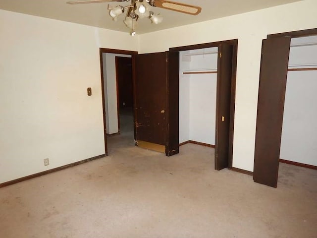 unfurnished bedroom with light carpet and ceiling fan