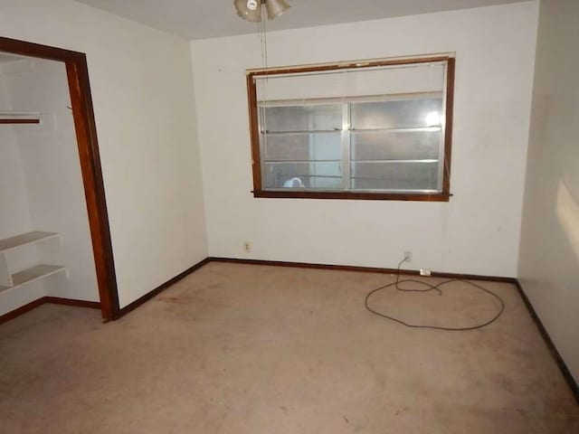 unfurnished room with light carpet