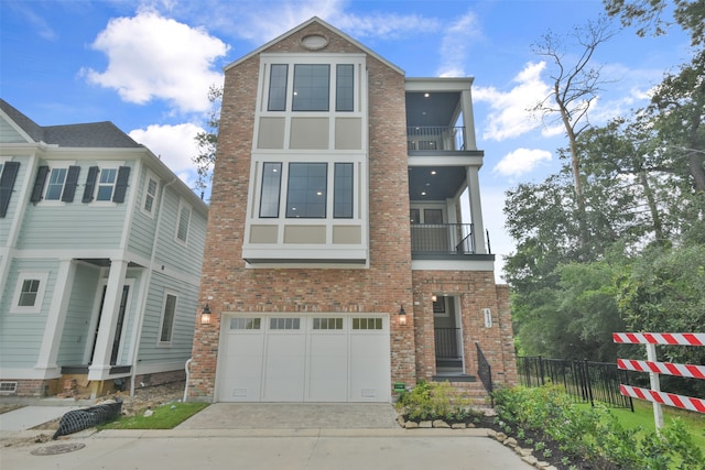 view of front facade featuring a balcony and a garage