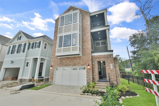 view of front of property with a front lawn, a garage, and a balcony