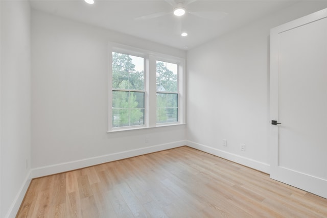 empty room featuring ceiling fan and light hardwood / wood-style floors