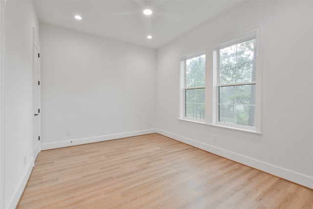 spare room featuring ceiling fan, plenty of natural light, and light hardwood / wood-style floors