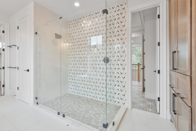 bathroom featuring a shower with shower door and tile patterned floors