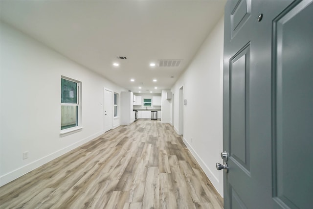 hall with light hardwood / wood-style flooring