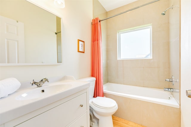 full bathroom featuring shower / bathtub combination with curtain, vanity, hardwood / wood-style floors, and toilet