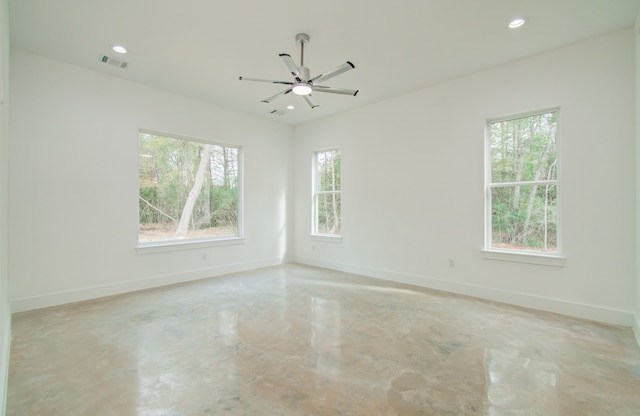 empty room with a healthy amount of sunlight and ceiling fan