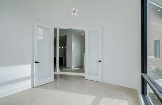 empty room featuring a notable chandelier