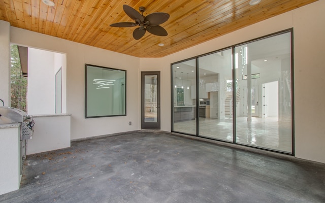 view of patio with a grill and ceiling fan