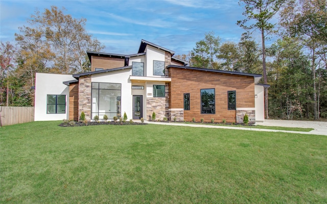 modern home featuring a front lawn