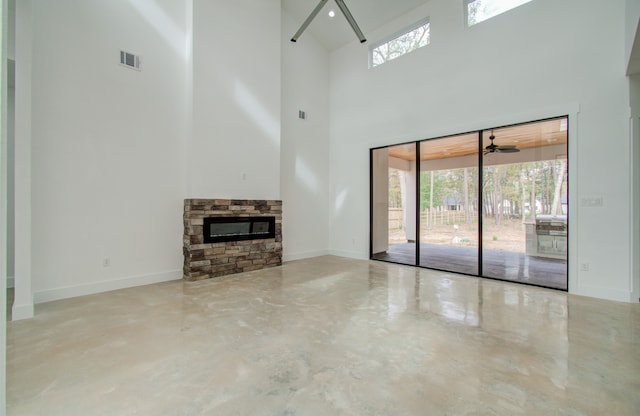 unfurnished living room featuring concrete floors and a healthy amount of sunlight