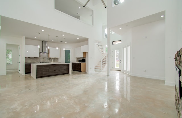 living room with a high ceiling