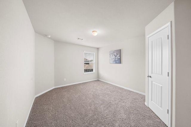 unfurnished room featuring carpet flooring