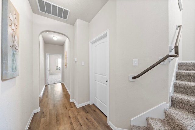 corridor featuring hardwood / wood-style floors