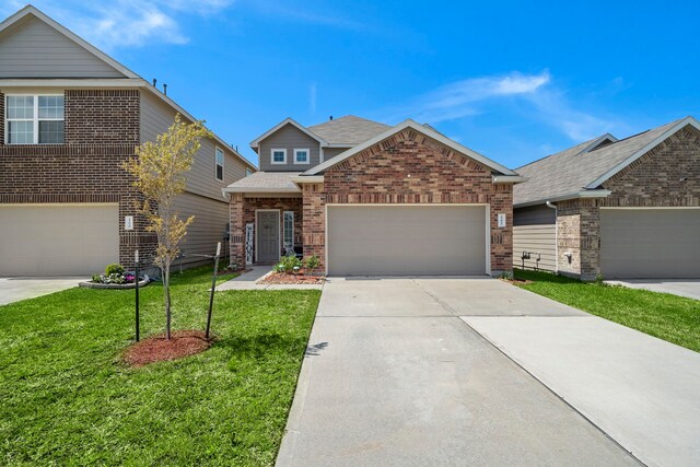 view of front of property featuring a garage and a front lawn