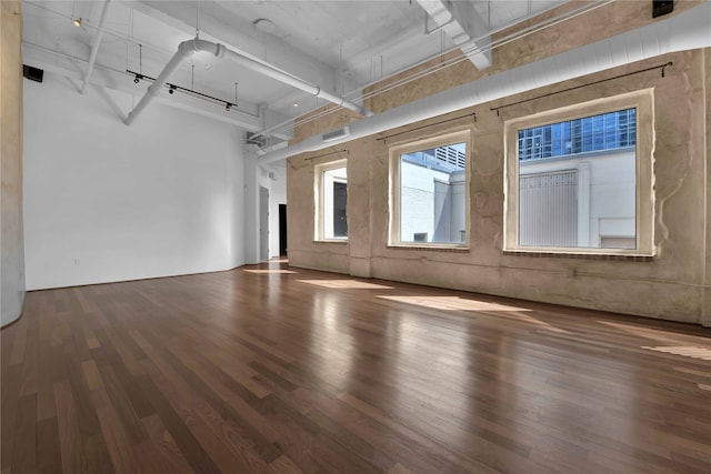 unfurnished living room featuring hardwood / wood-style floors