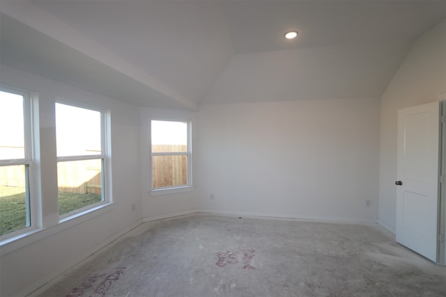 empty room with lofted ceiling