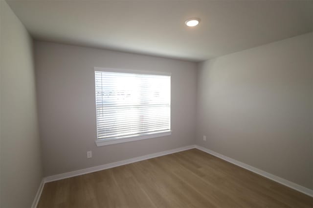 unfurnished room featuring wood-type flooring