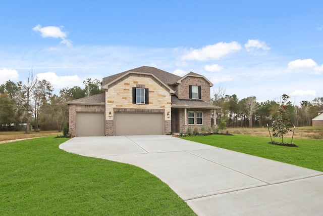 view of front of property with a garage and a front yard