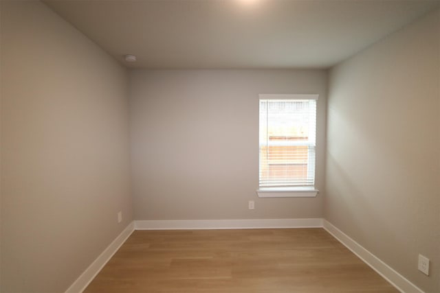 spare room with light wood-type flooring