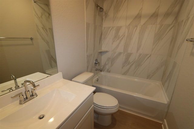 full bathroom featuring vanity, toilet, and tiled shower / bath combo