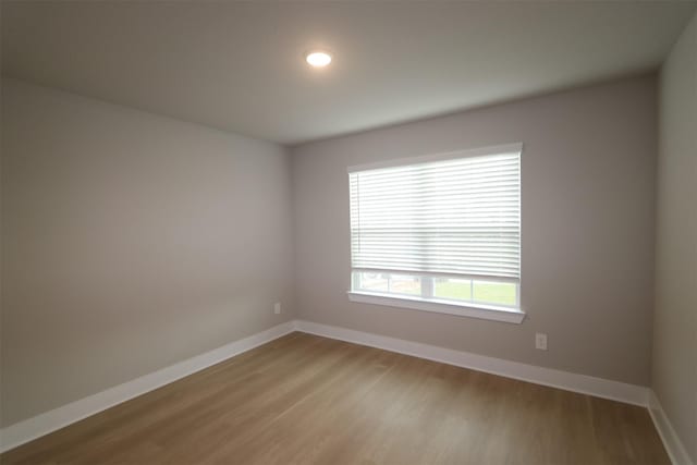 unfurnished room with light hardwood / wood-style floors